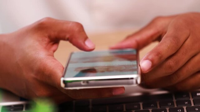 hand scrolling on a phone screen while browsing the internet