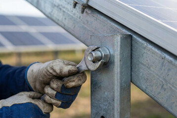 Technician Tightening Bolt On Agrivoltaic Solar Panel Mounting Structure.