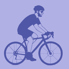 Obraz premium Cyclist riding a road bike with helmet and sunglasses.