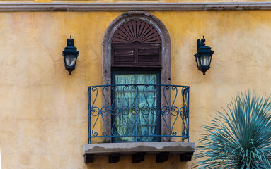 Window with window guard on an old house