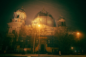 Iconic Berlin Cathedral Covered in Snow at Winter Time night