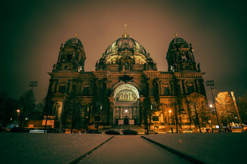 Iconic Berlin Cathedral Covered in Snow at Winter Time night