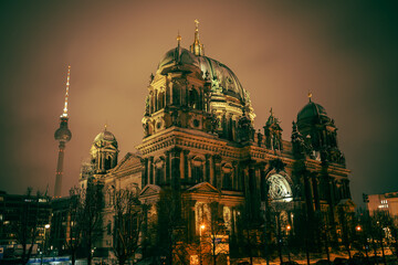 Iconic Berlin Cathedral Covered in Snow at Winter Time night