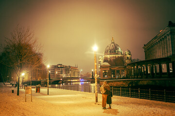 Iconic Berlin Cathedral Covered in Snow at Winter Time night