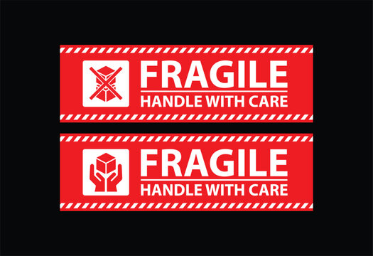 Red fragile handle with care labels show caution icons and clear warning text on a dark background, creating bold shipping and packaging signage for logistics, storage, and delivery operations.