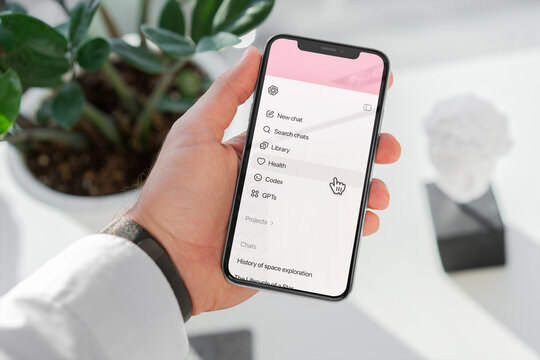 Hand navigating health section in chatgpt mobile app