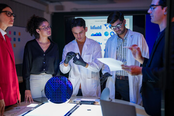 scientists and executives collaborating on Artificial Intelligence AI hardware development. Specialists inspecting a silicon wafer and high-speed RAM memory chip in a semiconductor laboratory.