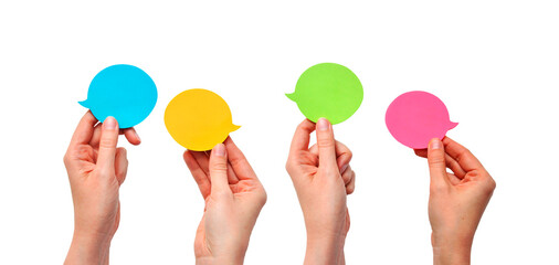 Communication and Dialogue Concept with Four Hands Holding Colorful Speech Bubbles