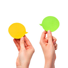 Different opinions of two people, or a dialogue, a conversation with speech bubbles in the hands on an isolated background