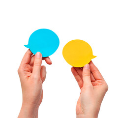 Different opinions of two people, or a dialogue, a conversation with speech bubbles in the hands on an isolated background
