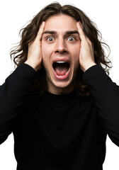 Young caucasian man in black top, pale, dark wavy hair, screaming in panic, hands gripping head on white studio background. Concept of intense emotional shock
