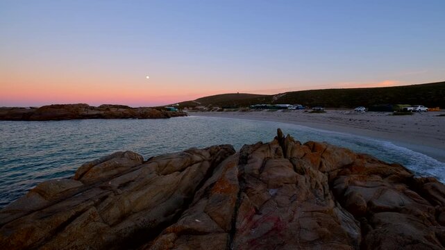 Twilight colors on horizon at dawn during moonset over South Africa West Coast
