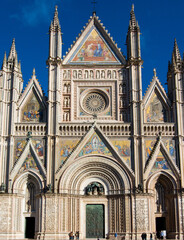 Ornate Orvieto cathedral facade showcasing gothic architecture,