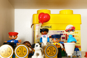 Obraz premium Minsk, Belarus - September 10, 2025: Colorful play corner in kindergarten featuring educational games, LEGO figures, and vibrant toys, creating a joyful learning environment for children