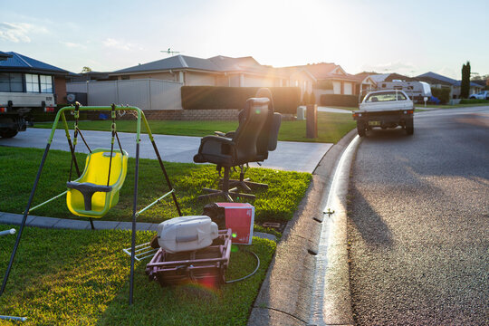 pile of junk and household rubbish on the kerbside for pickup during annual council cleanup  