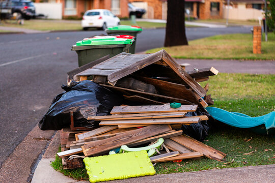 pile of junk and household rubbish on the kerbside for pickup during annual council cleanup  