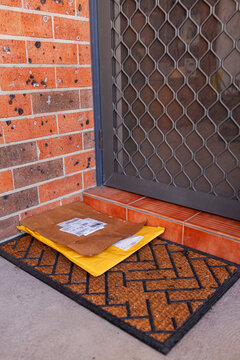 Parcel delivery on doormat of home in Australia