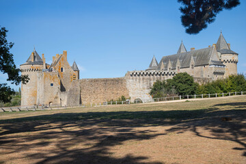 Entire view of Suscinio Castle surrounded by its moat on a sunny day. Background with copy space, no people. Sarzeau, Brittany, France.
