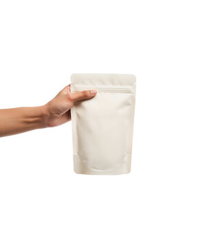 A hand holding a blank pouch, perfect for product mockups and branding. The pouch is off-white and ready for customization.