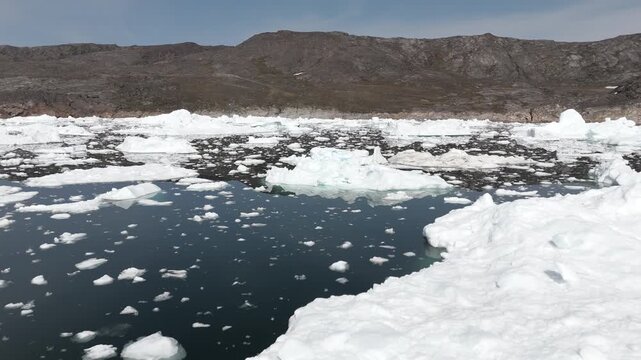 Very low horizontal pass skimming above dense floating Arctic ice