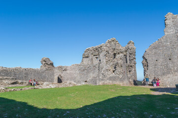 The inner courtyard of the ruins of Carreg Cennen Castle in Carmarthenshire, Wales on a sunny day
