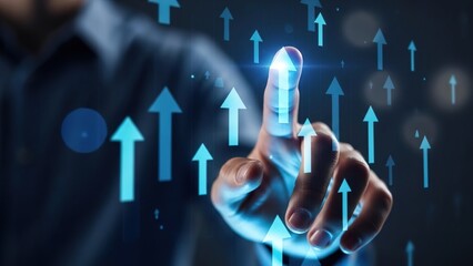 A person's hand interacting with a futuristic digital interface displaying numerous glowing blue upward arrows, symbolizing growth, progress, and business success.