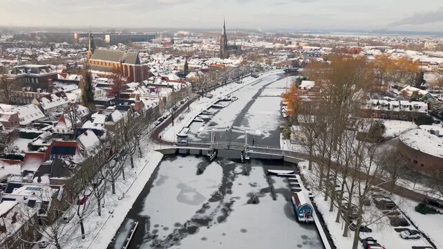 Aerial winter view of Weesp and river Vecht covered in snow, North Holland, Netherlands