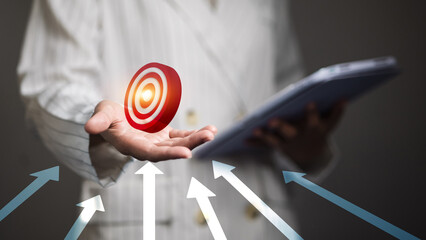 Businesswoman Holding Red Target Icon with Arrows for Strategic Goals and Achievement