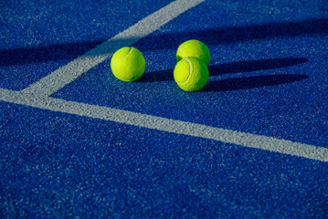 Yellow balls on blue ground with hard shadows. The Concept of Sunny Day.