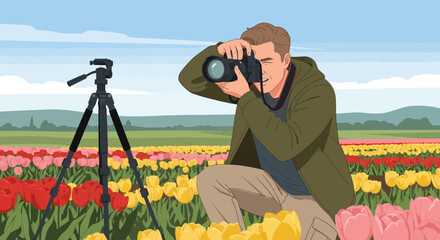 Young male photographer with a camera taking pictures in a colorful tulip field.