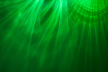 Paper abstraction. Highlights and shadows on green cardboard. Colored cardboard