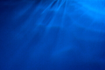 Paper abstraction. Highlights and shadows on blue cardboard. Colored cardboard