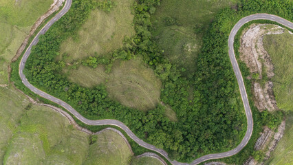 The beautiful and winding roads at the hilltops and across the savanna valleys when the grasses...