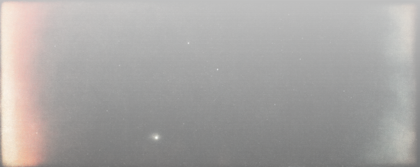 Neon Retro Film Overlay with glowing gradients, scattered light, and grain on dark background. Adds futuristic yet vintage cinematic style to visuals. Creates striking retro effect.	