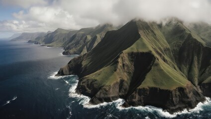 Dramatic Aerial View of Rugged Coastal Cliffs and Ocean Under a Cloudy Sky.