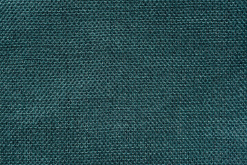 A close-up view of soft, organic cotton textile with a subtle, visible weave pattern.