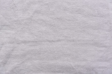 Detailed macro shot of a dark gray cotton material surface.