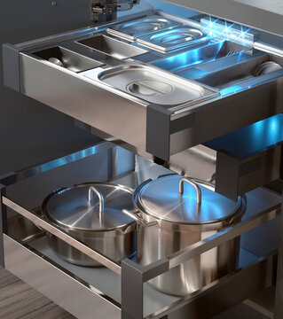 Close up of equipped drawers of a steel kitchen cabinet