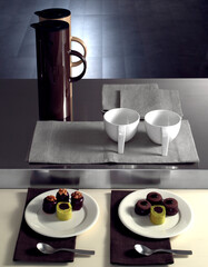 Still life with sweets and modern ceramics for breakfast