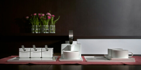 Still life with a modern tea set, in white ceramic