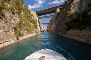 Passing through the Corinth Canal by yacht in Greece. 