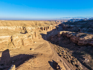 The eastern side of the Charyn Canyon in the rays of the evening sun.