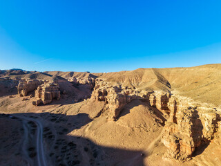 The hills of the eastern side of the Charyn Canyon in the rays of the evening sun.