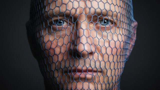 A man's face covered by a blue hexagonal mesh. Conceptual portrait representing digital identity, technology, and confinement - Powered by Adobe