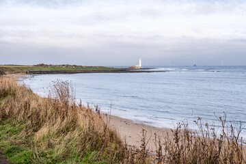landscape with St Mary's Lighthouse on the North Sea coast of England in Whitley Bay