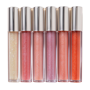 A sleek, modern tube of clear lip gloss with a shiny applicator, perfectly isolated set on high-quality PNG with a transparent background. The photo emphasizes the transparent packaging and glossy pro