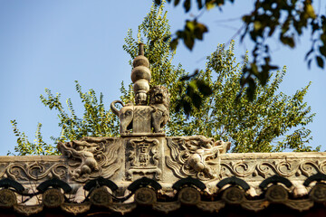 Obraz premium Traditional Chinese Roof Detail and Ridge Ornaments at Kuqa Palace, Xinjiang