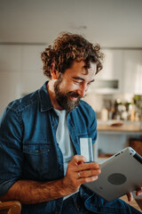 Man using tablet and credit card online shopping