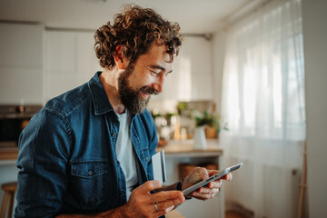 Man shopping online using tablet with credit card