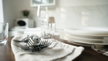 Clean Dishes And Forks Are Lying On The Table
